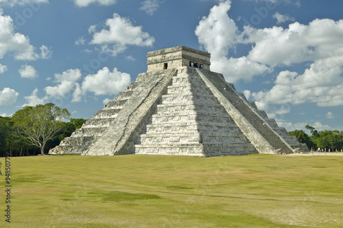 White puffy clouds over the Mayan Pyramid of Kukulkan  also known as El Castillo  and ruins at Chichen Itza  Yucatan Peninsula  Mexico