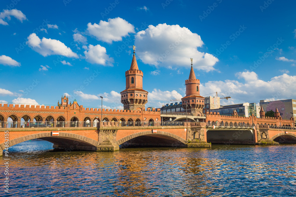 Berlin Oberbaum Bridge on a sunny day with clouds, Berlin Friedrichshain-Kreuzberg, Germany