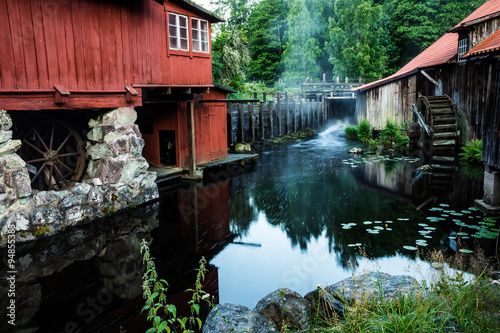 historical buildings of old steelworks by stream