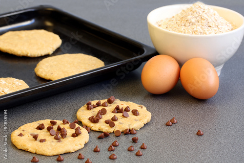 preparation pastry: chocolate chip cookies on grey background with copy space