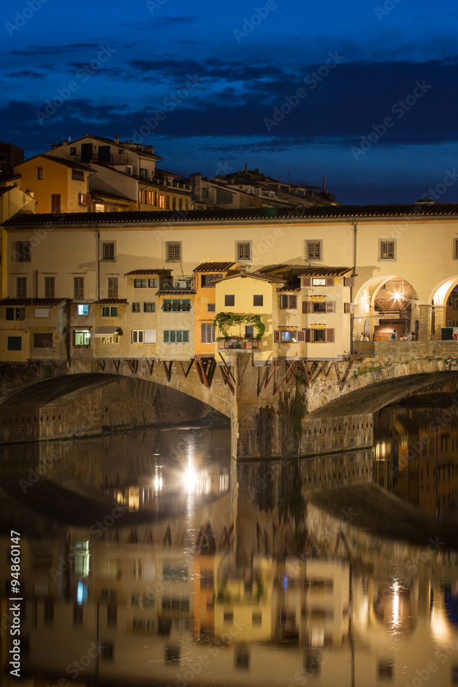 View of Gold (Ponte Vecchio) Bridge at night in Florence, Tuscan