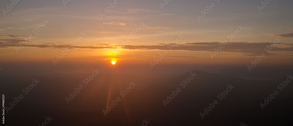 Landscape of sunrise flare lighting and mountain at Phu ruea national park, Loei -Thailand