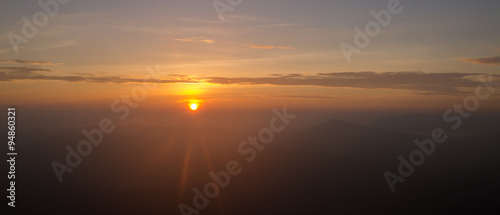 Landscape of sunrise flare lighting and mountain at Phu ruea national park, Loei -Thailand