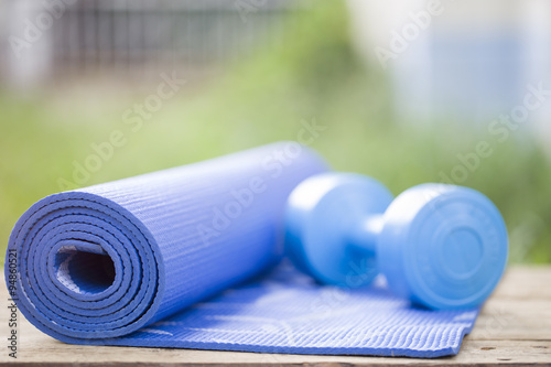 yoga mat and dumbbell