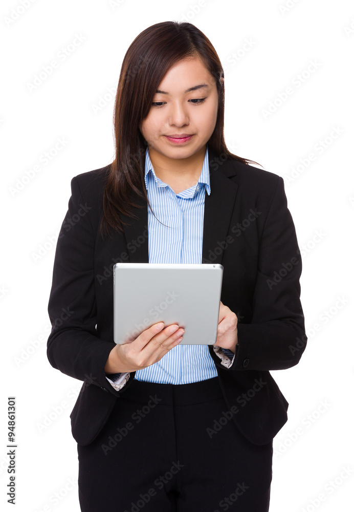 Asian Young Businesswoman use of the tablet pc Asian Young Businesswoman use of the tablet pc