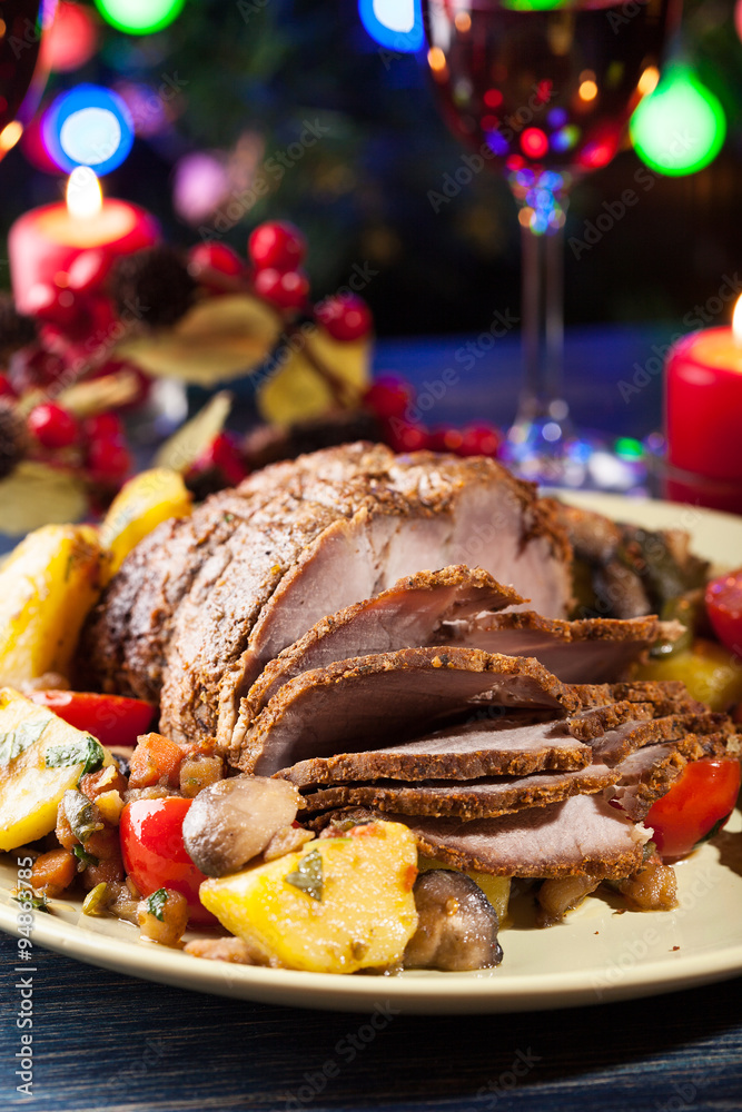 Juicy roast pork on the holiday table Juicy roast pork on the holiday table