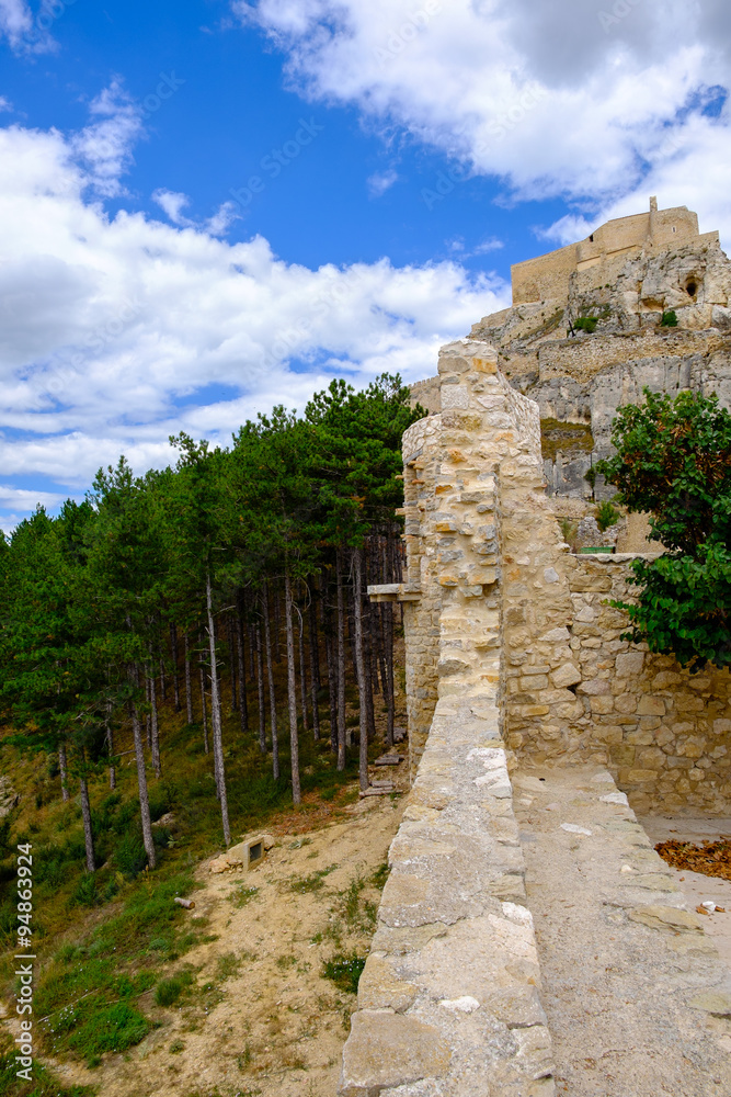 Ancient walls of Morella castle and the pine wood behind, the province of Castellon, Spain.