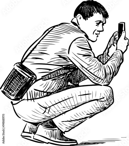 man takes picture on a mobile phone