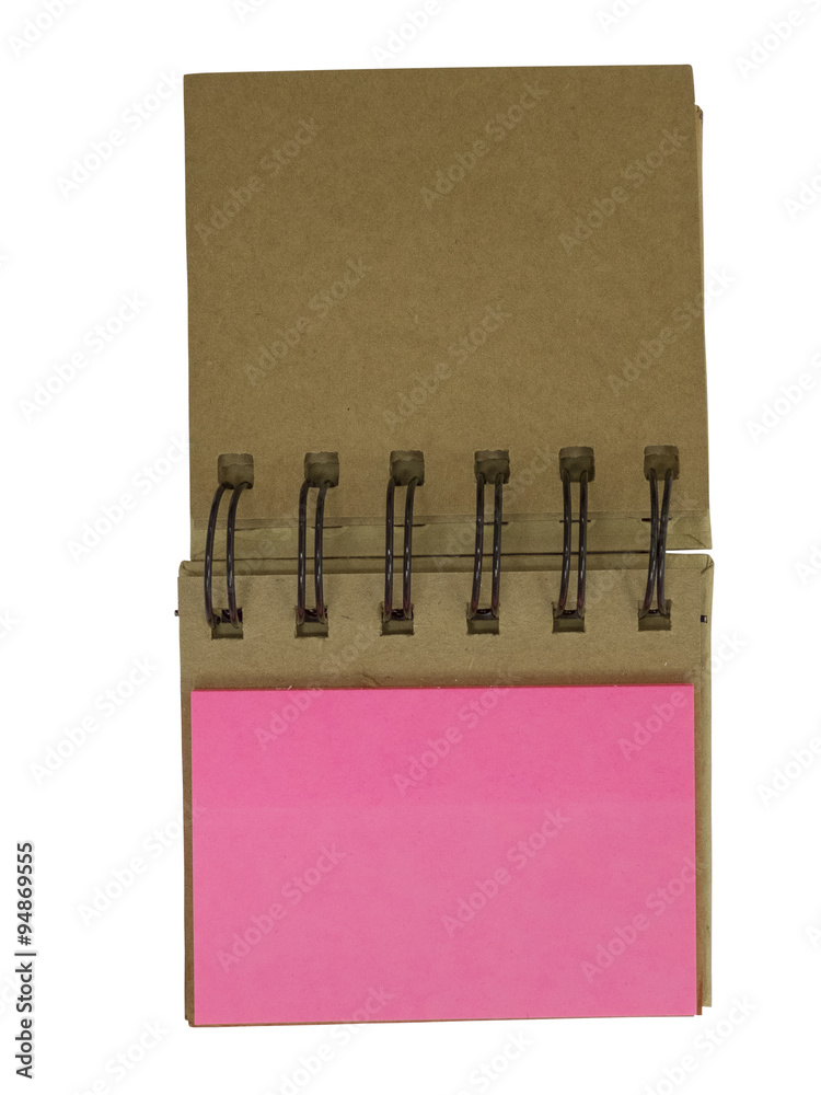 Blank sticky notes stuck to spiral notebook Blank sticky notes stuck to spiral notebook