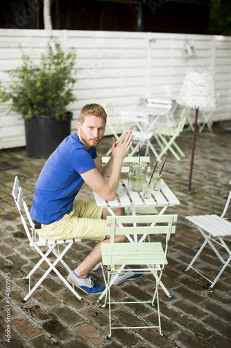 Young man sitting in the cafe © BGStock72