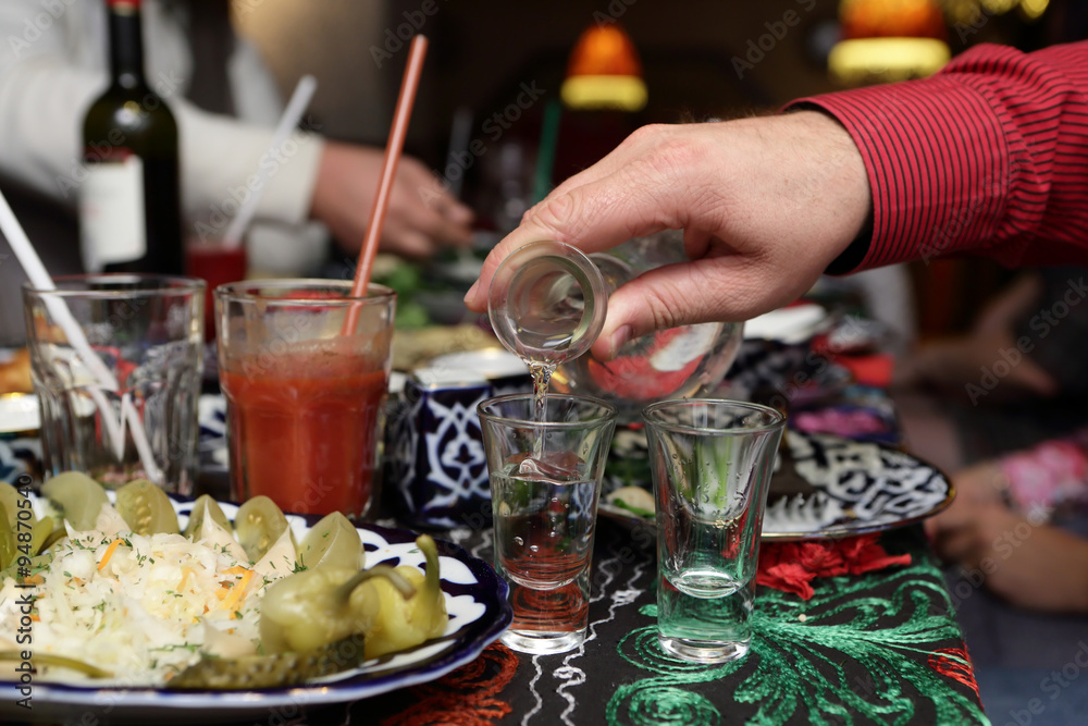 Person pouring vodka Person pouring vodka