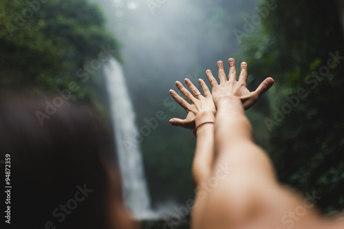 hands outstretched in the Waterfalls