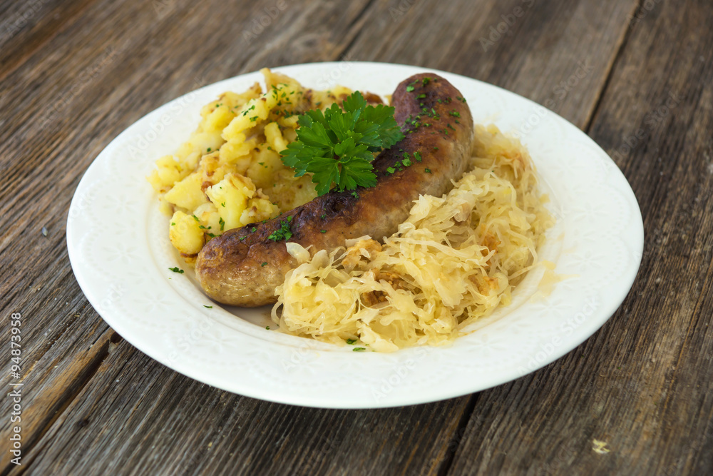 Roasted sausages with sauerkraut and potatoes Roasted sausages with sauerkraut and potatoes