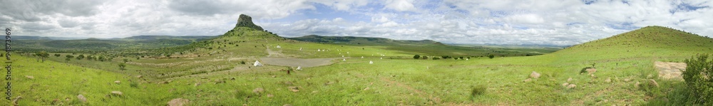 Panoramic view of Sandlwana hill or Sphinx with soldiers graves in foreground, the scene of the Anglo Zulu battle site of January 22, 1879. The great Battlefield of Isandlwana and the Oskarber, Zululand, northern Kwazulu Natal, South Africa Panoramic view of Sandlwana hill or Sphinx with soldiers graves in foreground, the scene of the Anglo Zulu battle site of January 22, 1879. The great Battlefield of Isandlwana and the Oskarber, Zululand, northern Kwazulu Natal, South Africa