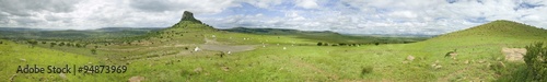 Panoramic view of Sandlwana hill or Sphinx with soldiers graves in foreground, the scene of the Anglo Zulu battle site of January 22, 1879. The great Battlefield of Isandlwana and the Oskarber, Zululand, northern Kwazulu Natal, South Africa