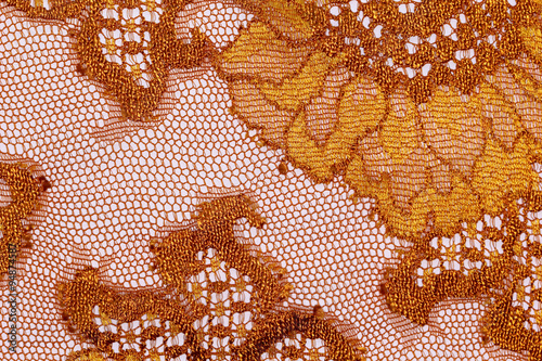The macro shot of the orange and brown lace texture materia