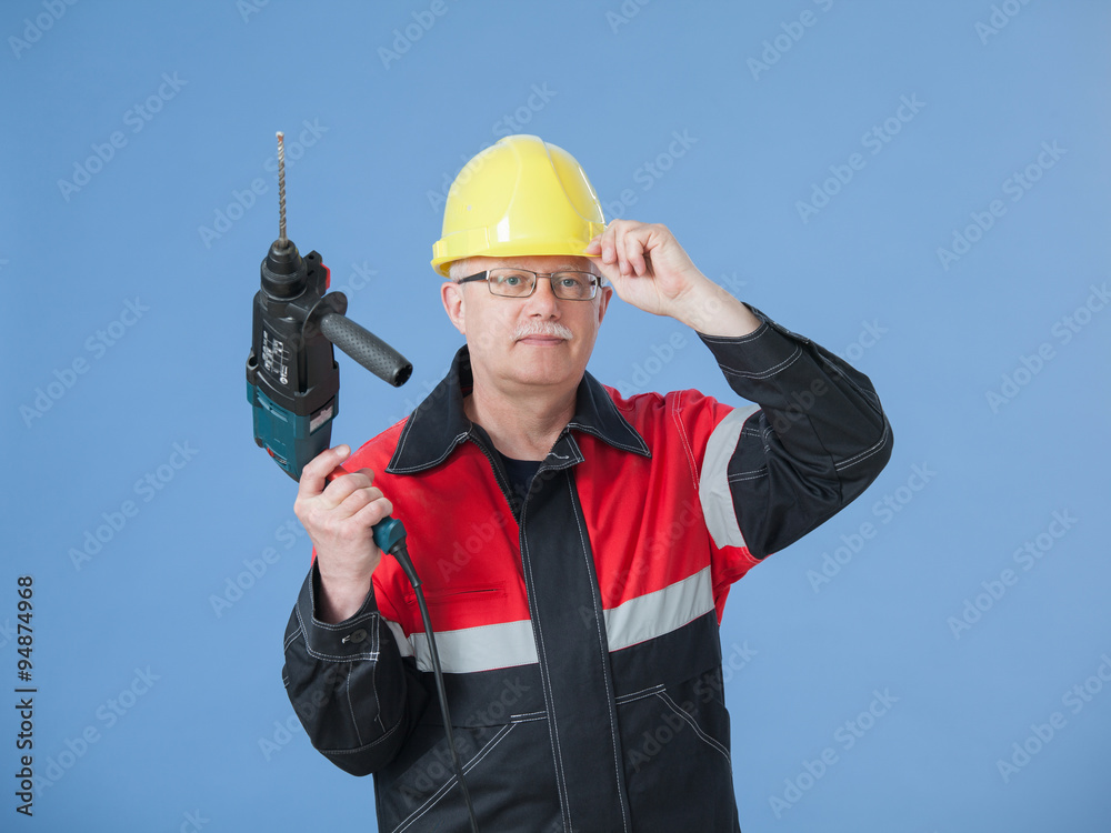 Builder holding a drill Builder holding a drill