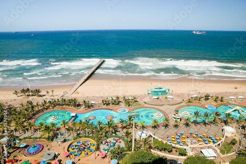 Aerial view of Indian Ocean, white sandy beaches, pool and ocean pier in the town center of Durban, South Africa photo