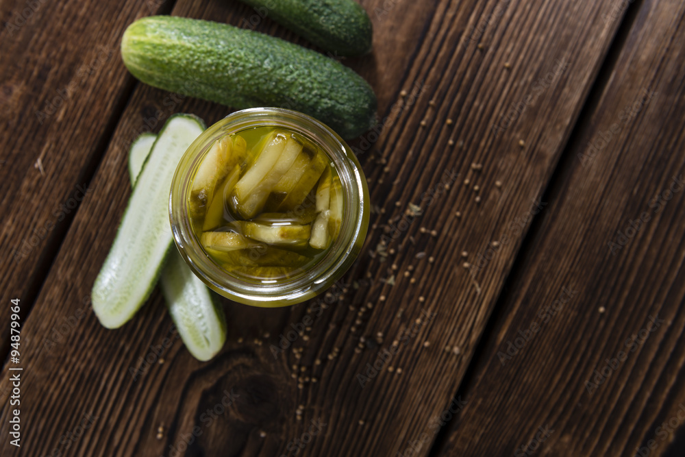 Portion of sliced and pickled Cucumbers Portion of sliced and pickled Cucumbers