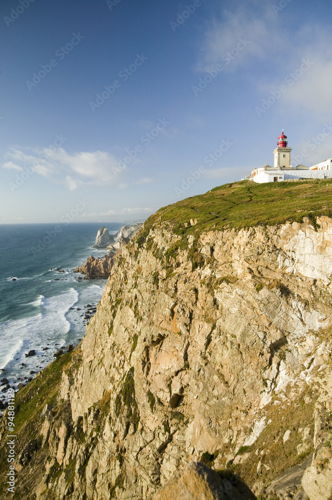 Cliffs and lighthouse of Cabo da Roca on the Atlantic Ocean in Sintra, Portugal, the westernmost point on the continent of Europe, which the poet Cam›es defined as 