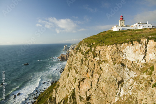 Cliffs and lighthouse of Cabo da Roca on the Atlantic Ocean in Sintra, Portugal, the westernmost point on the continent of Europe, which the poet Cam›es defined as "where the land ends and the sea begins".