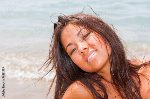 Asian beautiful girl smiling happy on beach