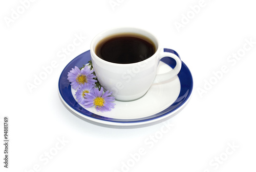 coffee on the saucer with a blue border decorated with three blu