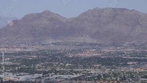 Aerial view from above looking at buildings, mountains and streets of Las Vegas, Nevada, USA