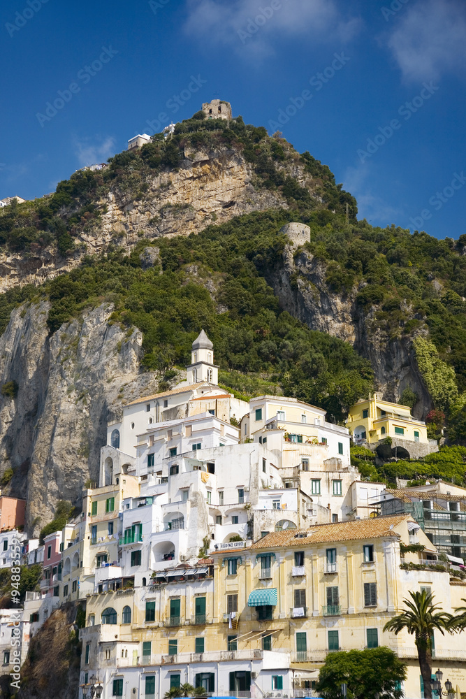 View of colorful buildings along seaside in Amalfi, a town in the province of Salerno, in the region of Campania, Italy, on the Gulf of Salerno, 24 miles southeast of Naples