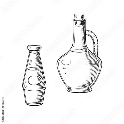 Olive oil and tomato sauce in glass bottles