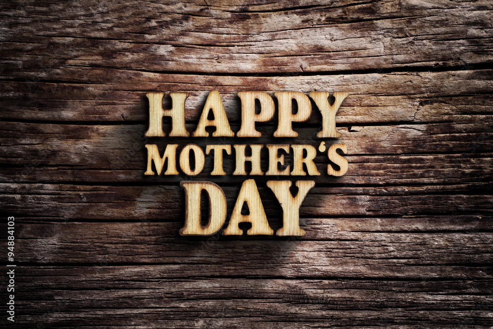 Fototapeta premium Happy Mother's Day. Words on old wooden board.
