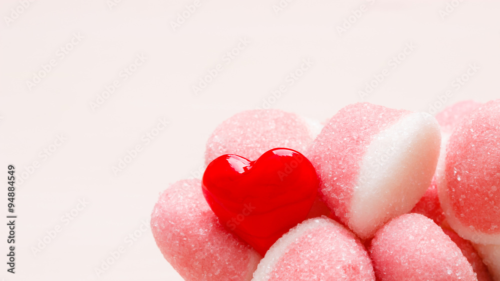 Pink jellies or marshmallows with sugar closeup Pink jellies or marshmallows with sugar closeup