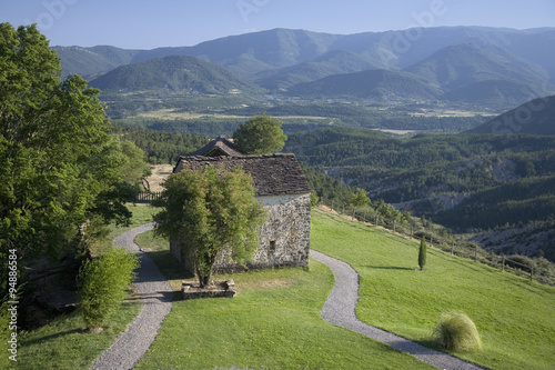 Fototapeta Valley view and Casa de San Martin Inn, in Aragon, in the Pyrenees Mountains, Pr
