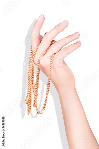 Hand with golden chain isol...