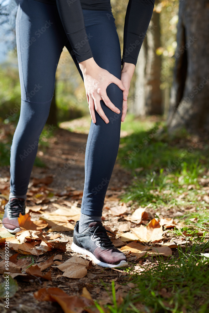 Knee Injury - sports running knee injuries on woman. Male runner