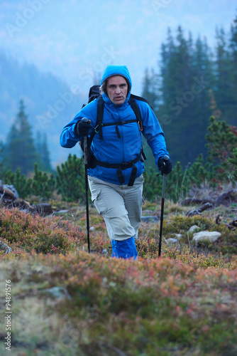 advanture man with backpack hiking