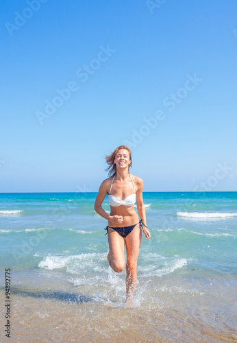 An attractive young woman at the beach © Netfalls