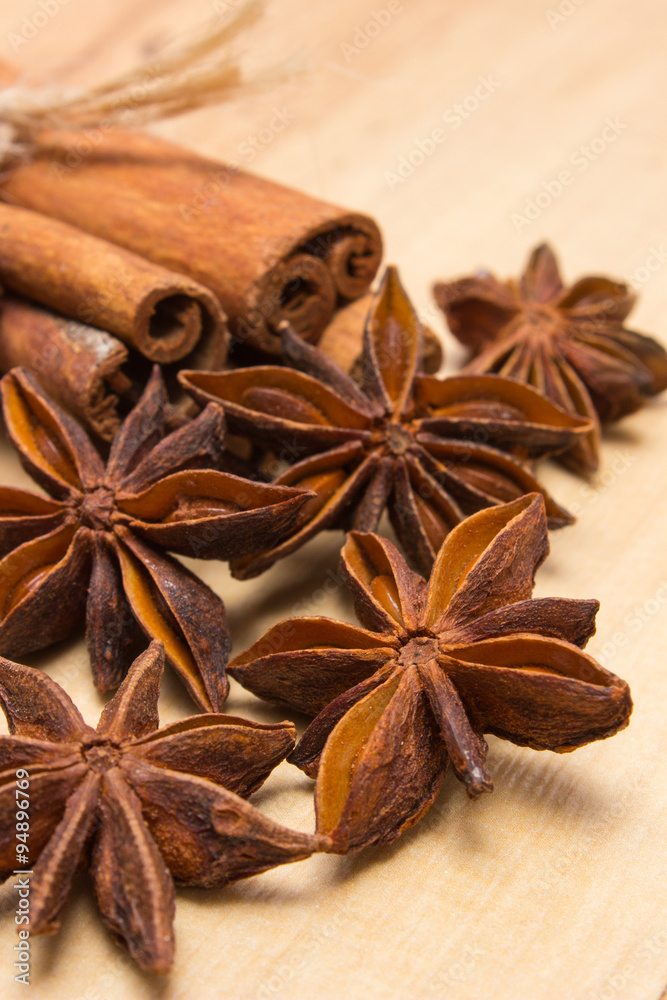 Cinnamon sticks and anise on wooden table, seasoning for cooking Cinnamon sticks and anise on wooden table, seasoning for cooking