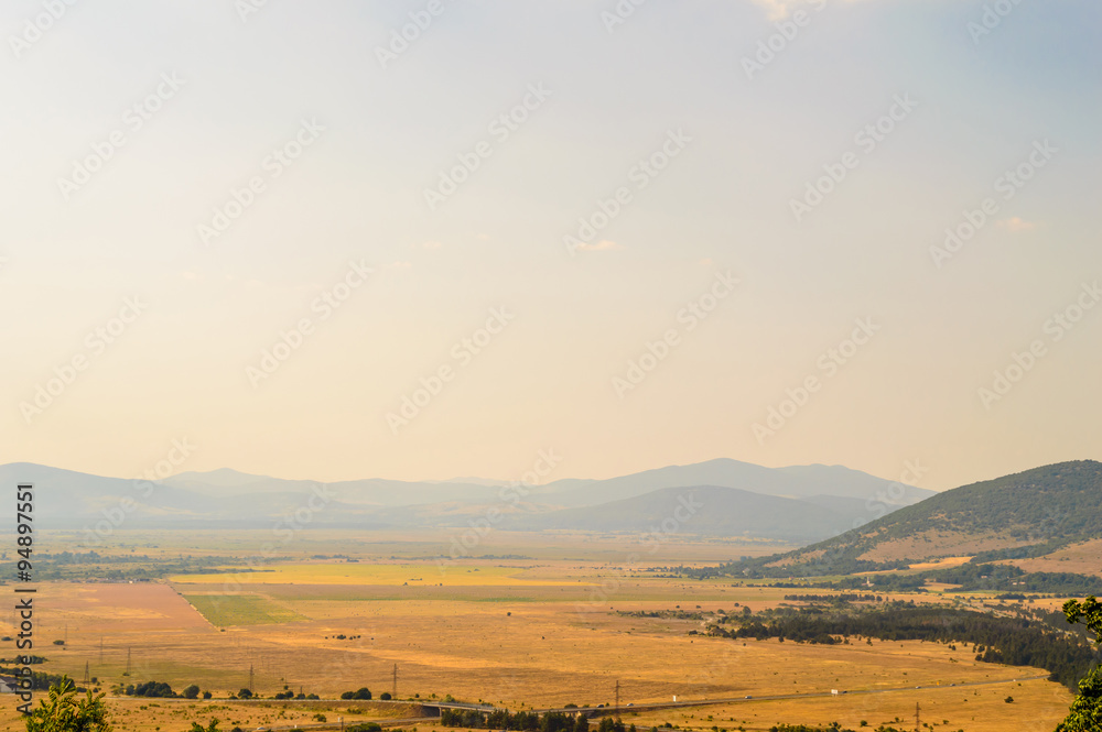 Fototapeta premium Rural landscape with late afternoon sky and farmland