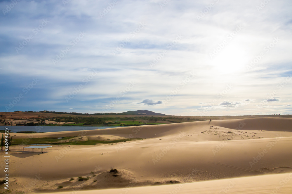 Landscape of White sand dune desert with blue sky cloud at Mui n
