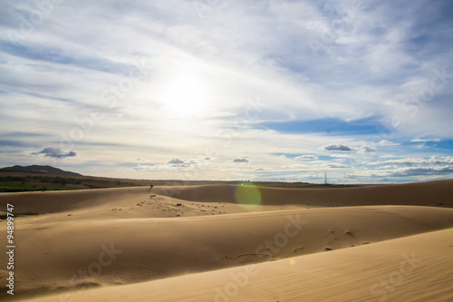 Landscape of White sand dune desert with blue sky cloud at Mui n
