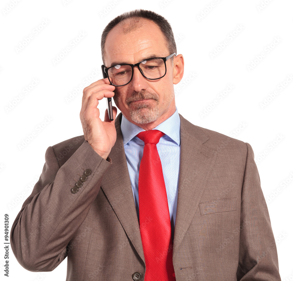 sad old businessman talking on the phone sad old businessman talking on the phone