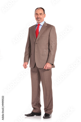 full body picture of a mature senior businessman standing