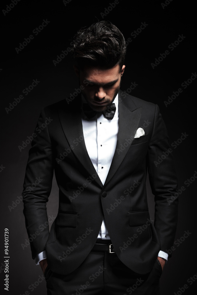 Fototapeta premium elegant young business man looking down
