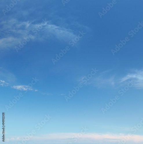 plumose clouds in the blue sky