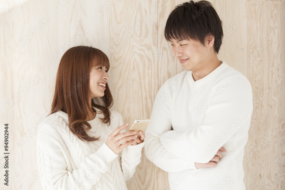 Young couple laughing happily face to face Young couple laughing happily face to face