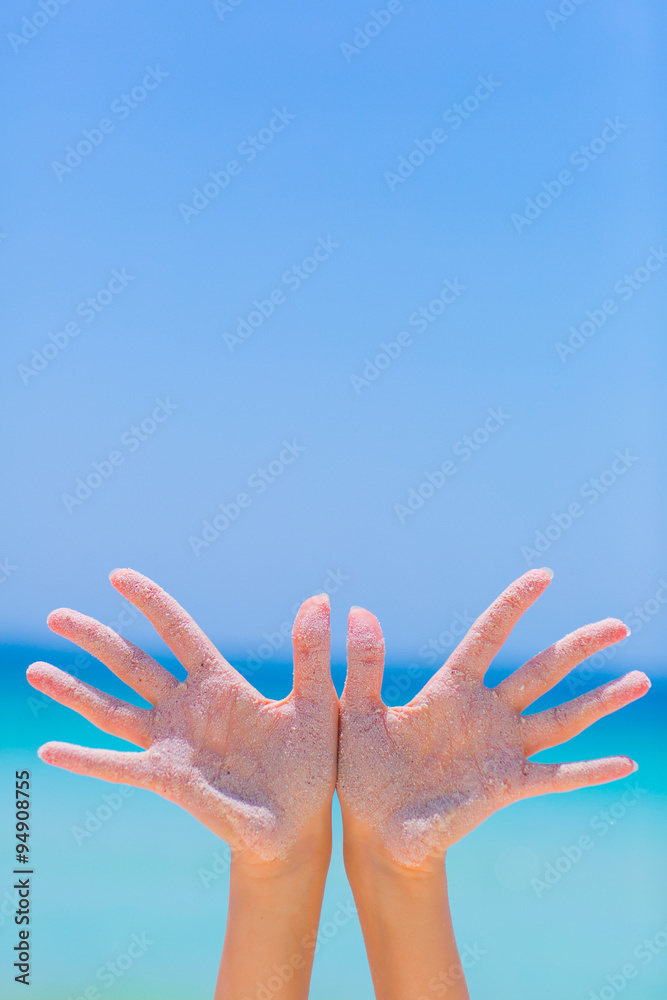 Female open hand on blue sea background Female open hand on blue sea background