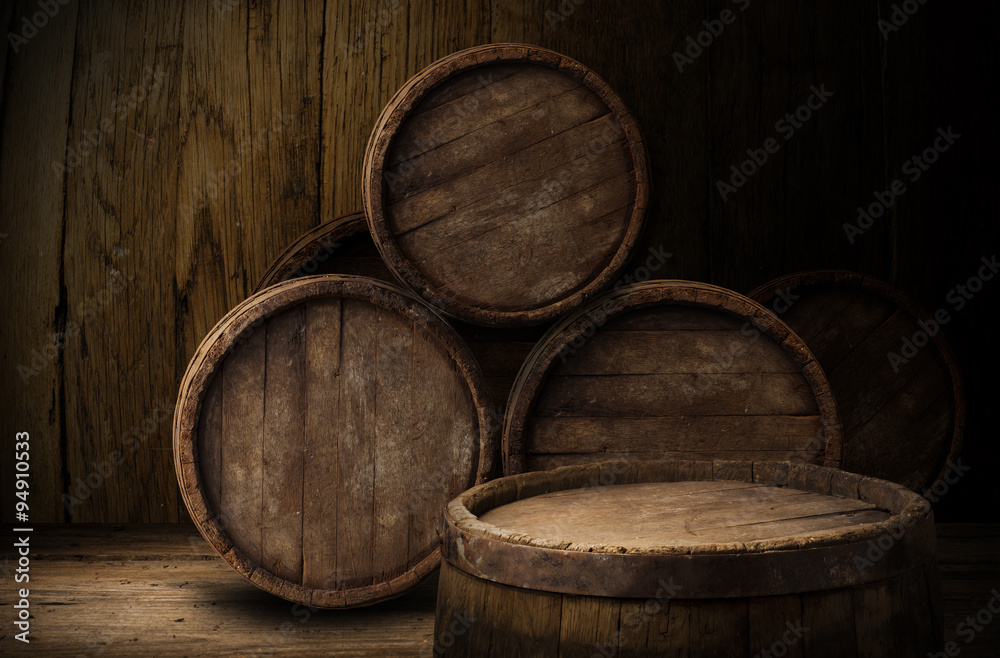 Beer barrel with beer glasses on table on wooden background