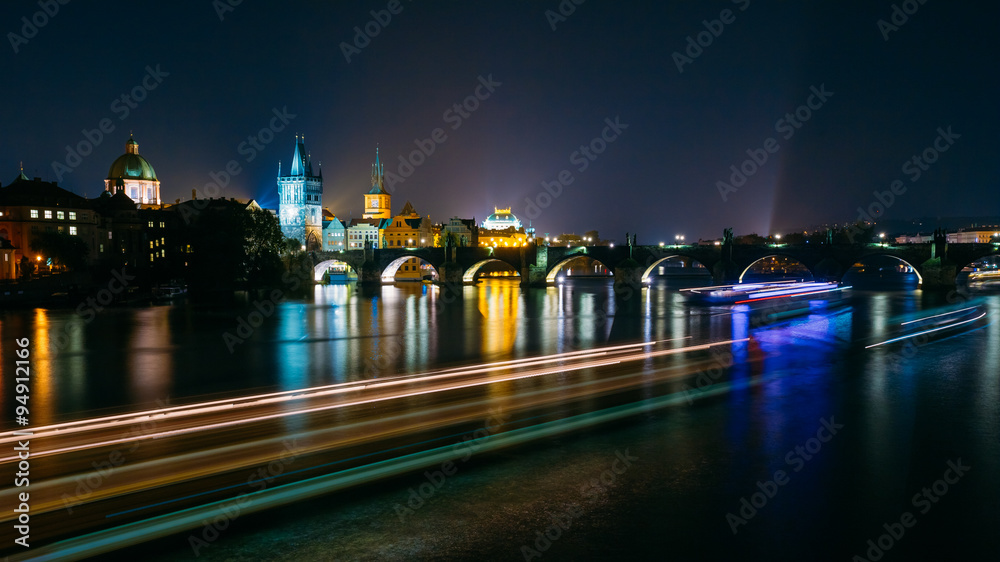 Night panoramic view of illuminated Charles Bridge in Prague, Cz