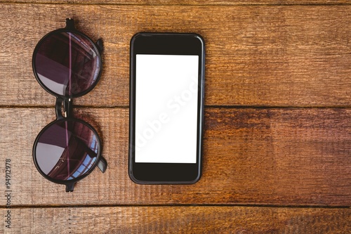 View of glasses and a smartphone
